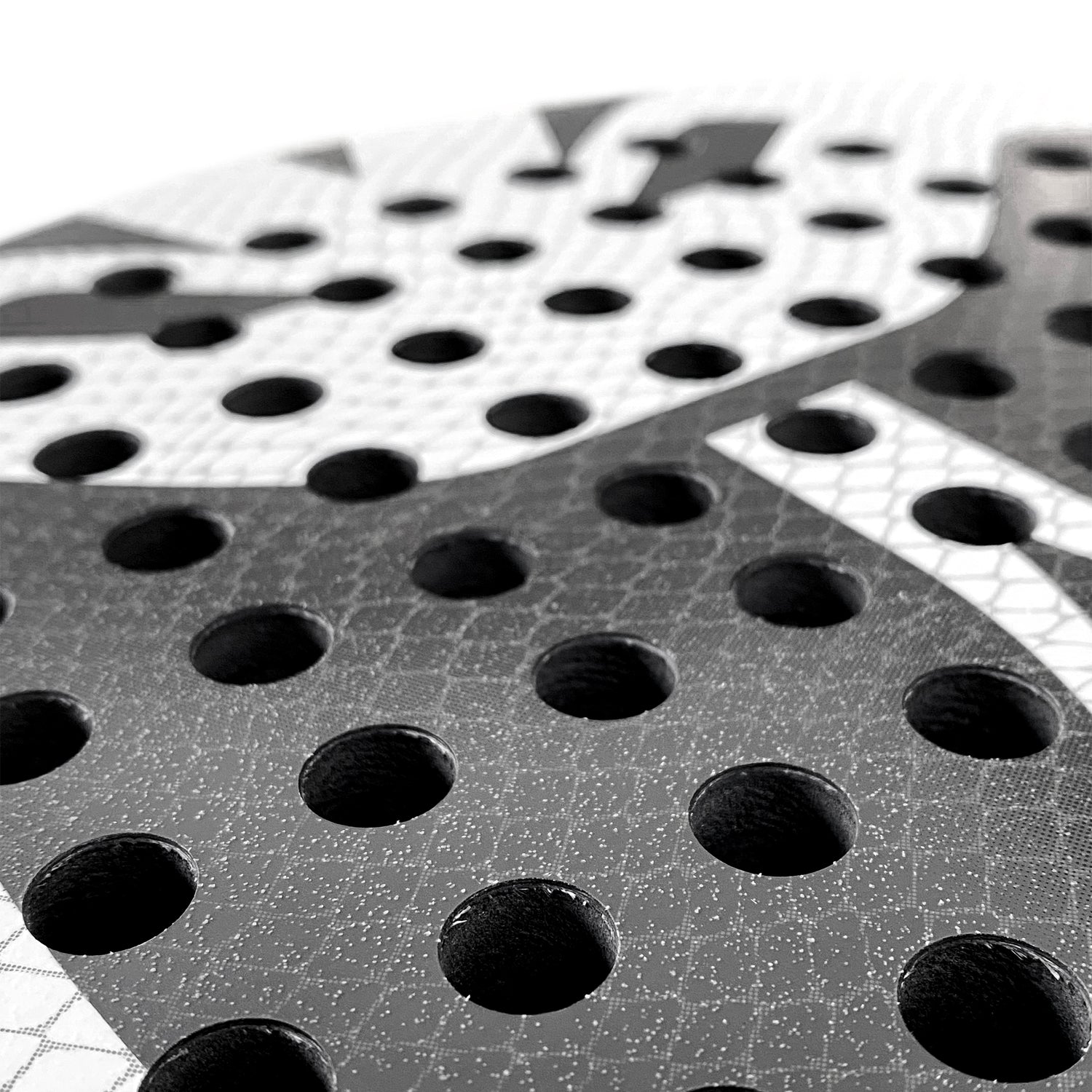 Kobura Strike Pro 12K close up of the grit sand structure surface of the padel racket