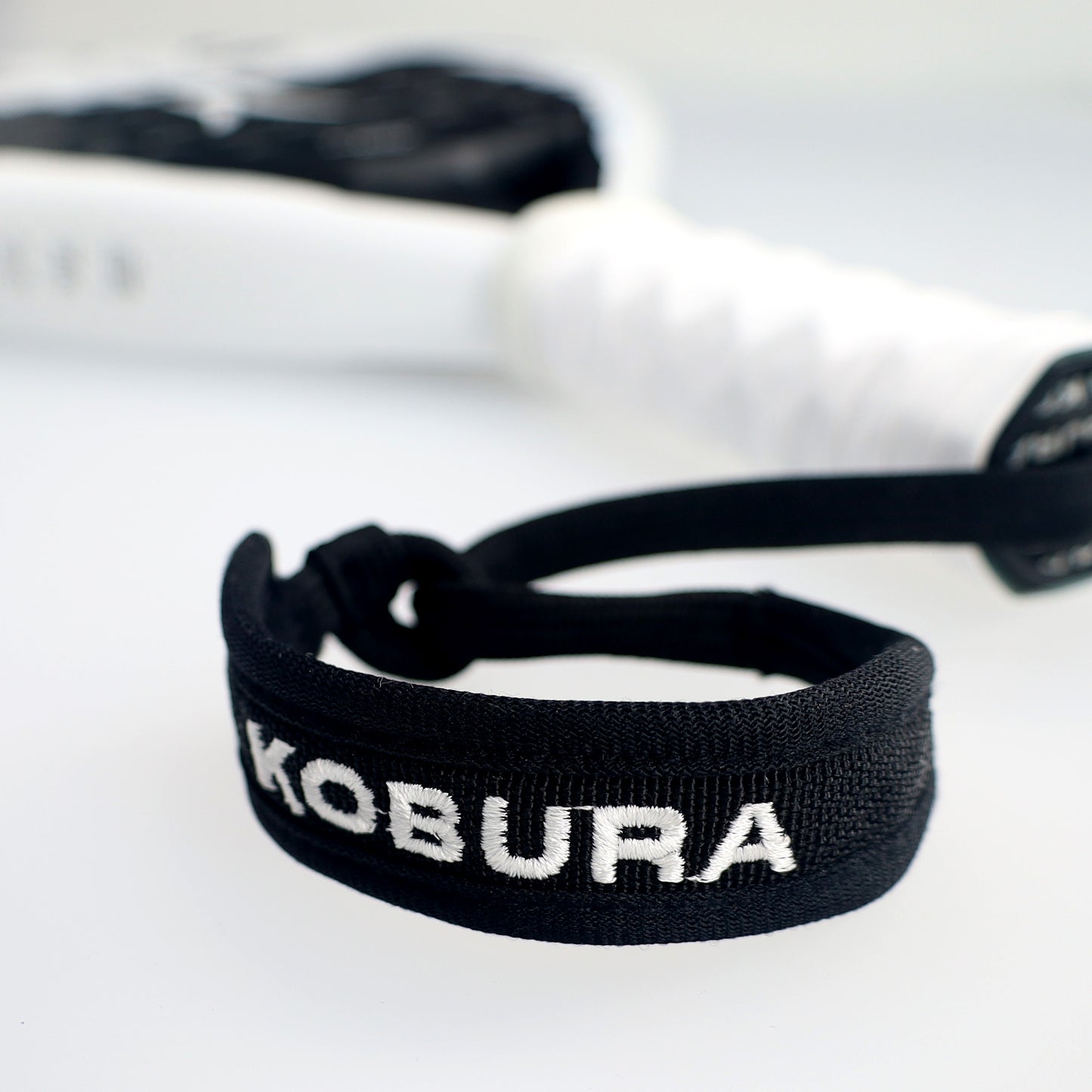 wrist band and strap of the kobura strike pro 12K padel racket